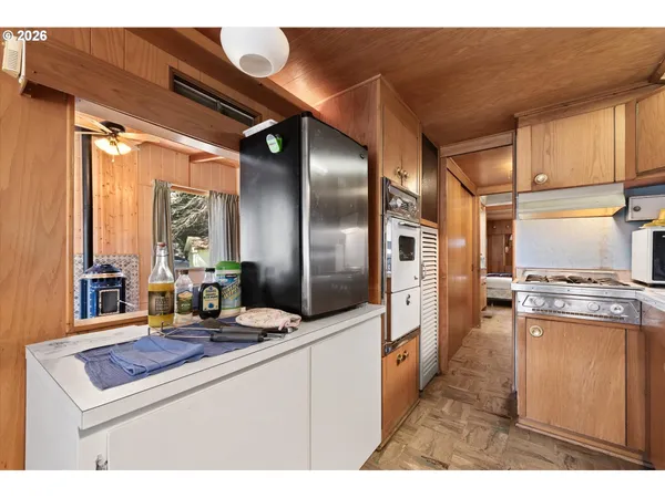 a kitchen with stainless steel appliances kitchen island granite countertop a stove a sink and dishwasher