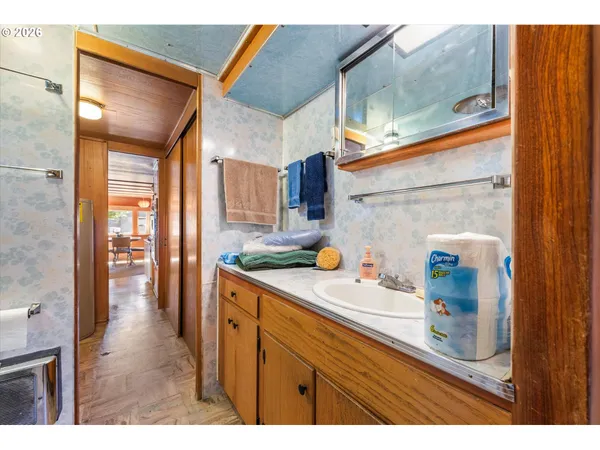 a bedroom with a bed and cabinet