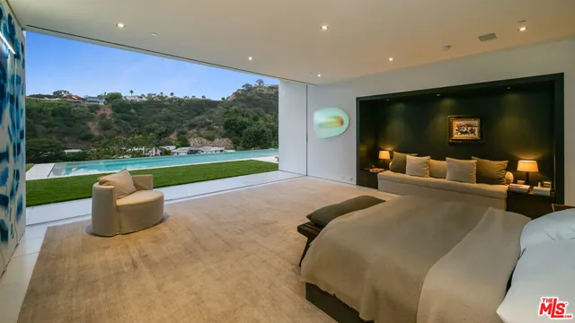 a bed room with a bed and a television