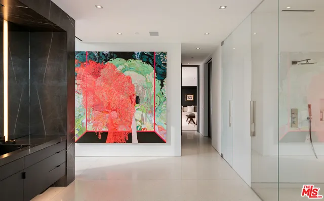 a view of walk in closet with clothes