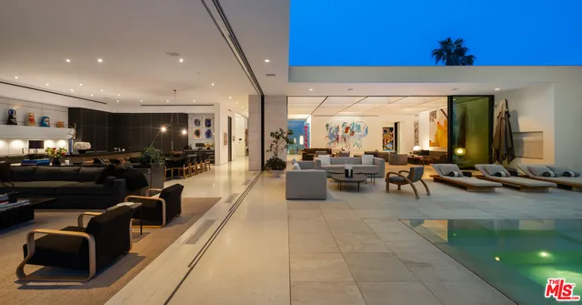 a lobby with furniture and a potted plant