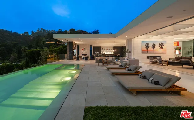 a gym with pool table and chairs