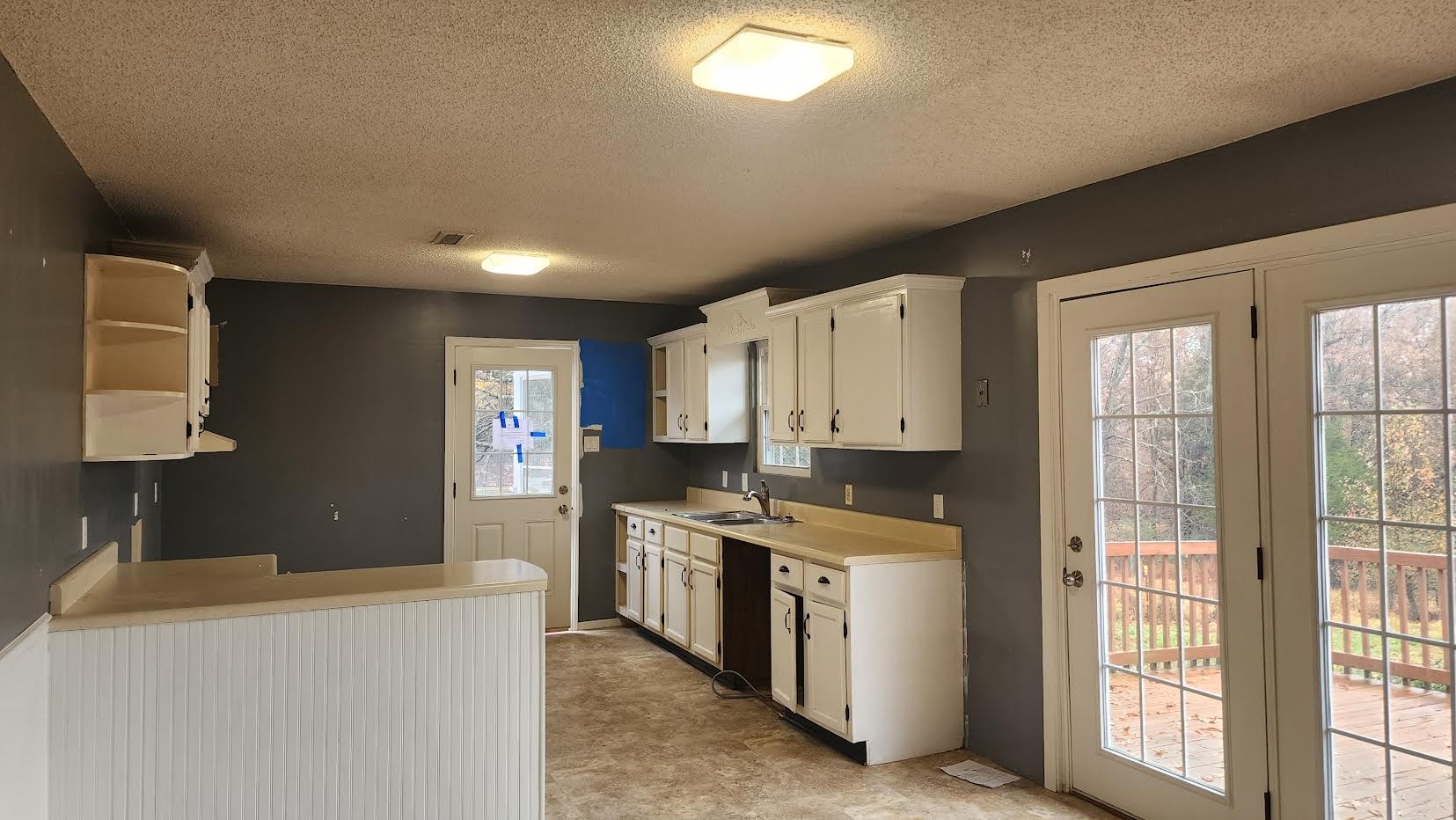 1140 Country Club Road Paris, TN 38242 - Photo 3 of 15 a kitchen with stainless steel appliances granite countertop a stove a sink and a refrigerator