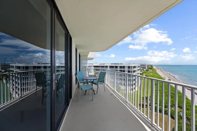a view of a balcony with chairs