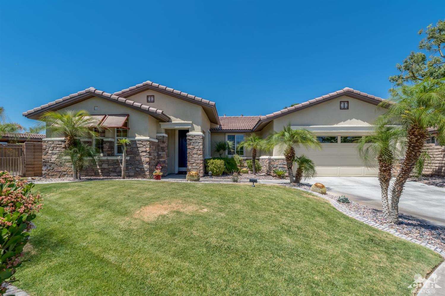 145 Via Solaro Rancho Mirage, CA 92270 - Photo 1 of 40 a view of a house with a yard and porch