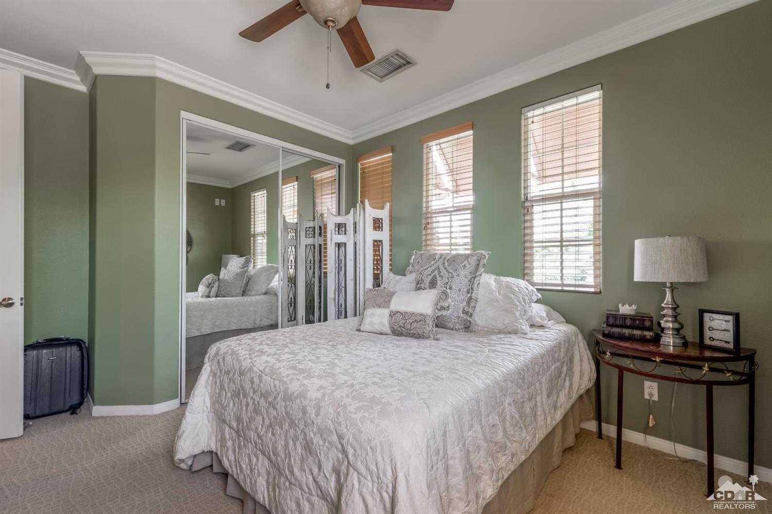 145 Via Solaro Rancho Mirage, CA 92270 - Photo 13 of 40 a bedroom with a bed and a table