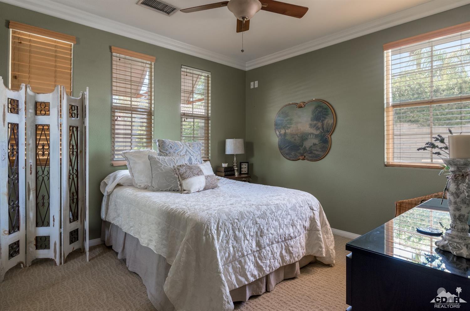 145 Via Solaro Rancho Mirage, CA 92270 - Photo 14 of 40 a bedroom with a bed and a window