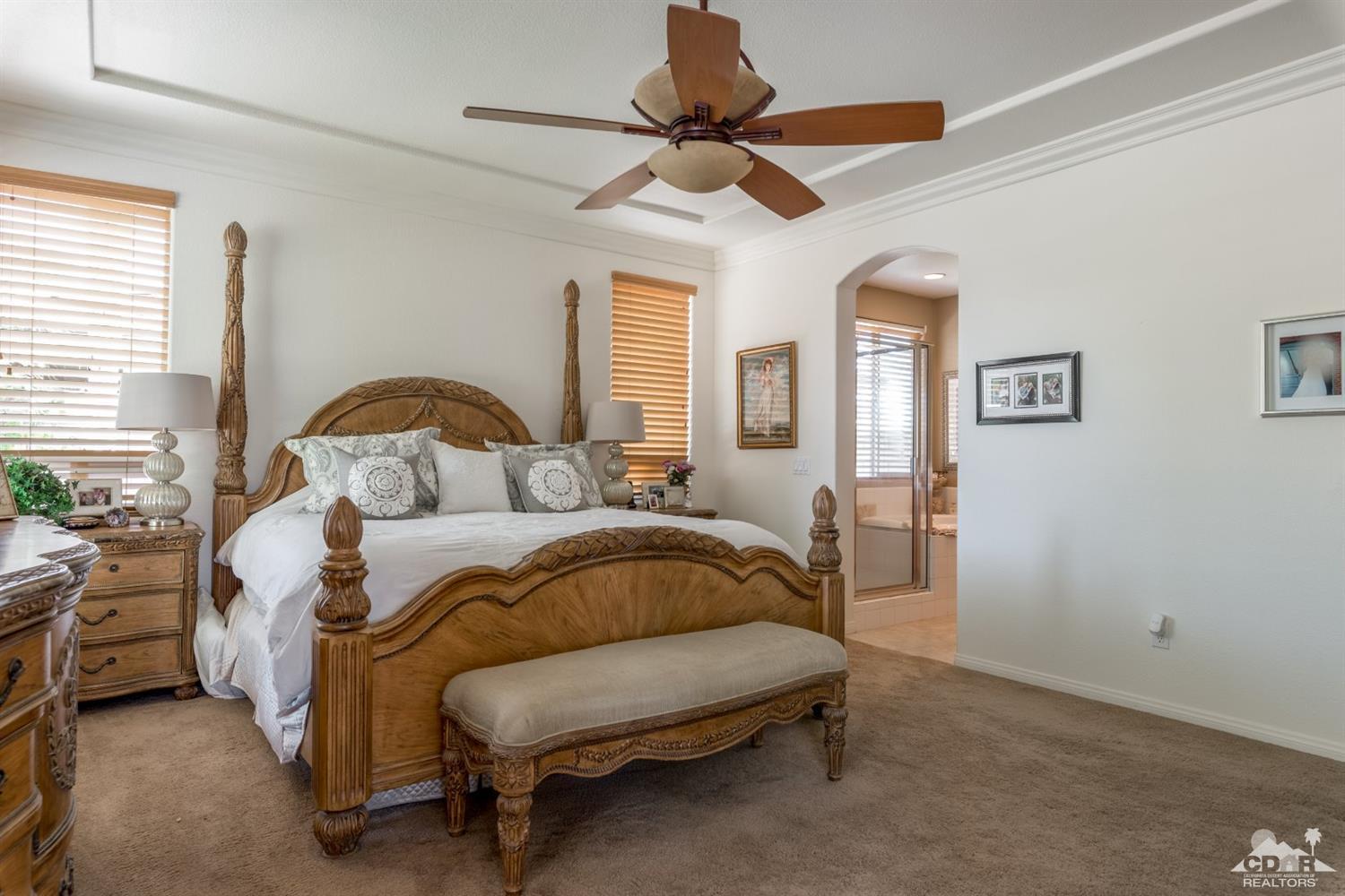 145 Via Solaro Rancho Mirage, CA 92270 - Photo 17 of 40 a bedroom with a bed and window