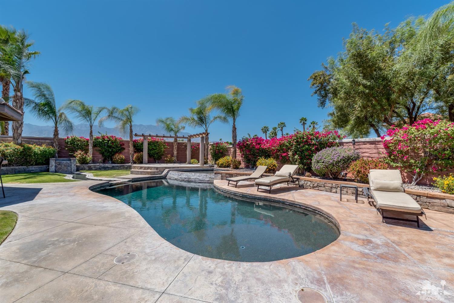 145 Via Solaro Rancho Mirage, CA 92270 - Photo 25 of 40 a view of a swimming pool with outdoor seating