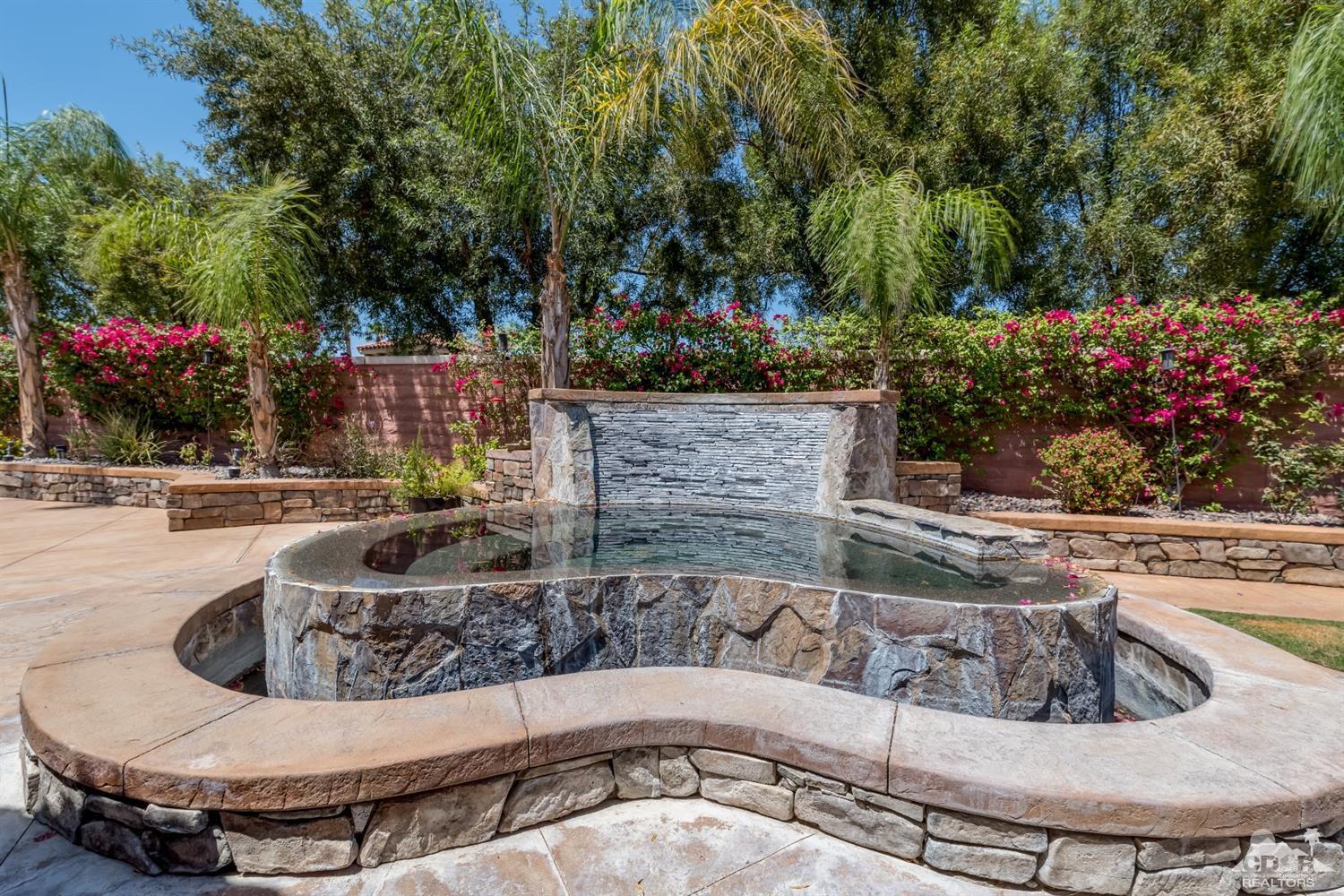 145 Via Solaro Rancho Mirage, CA 92270 - Photo 32 of 40 a view of a house with backyard and sitting area