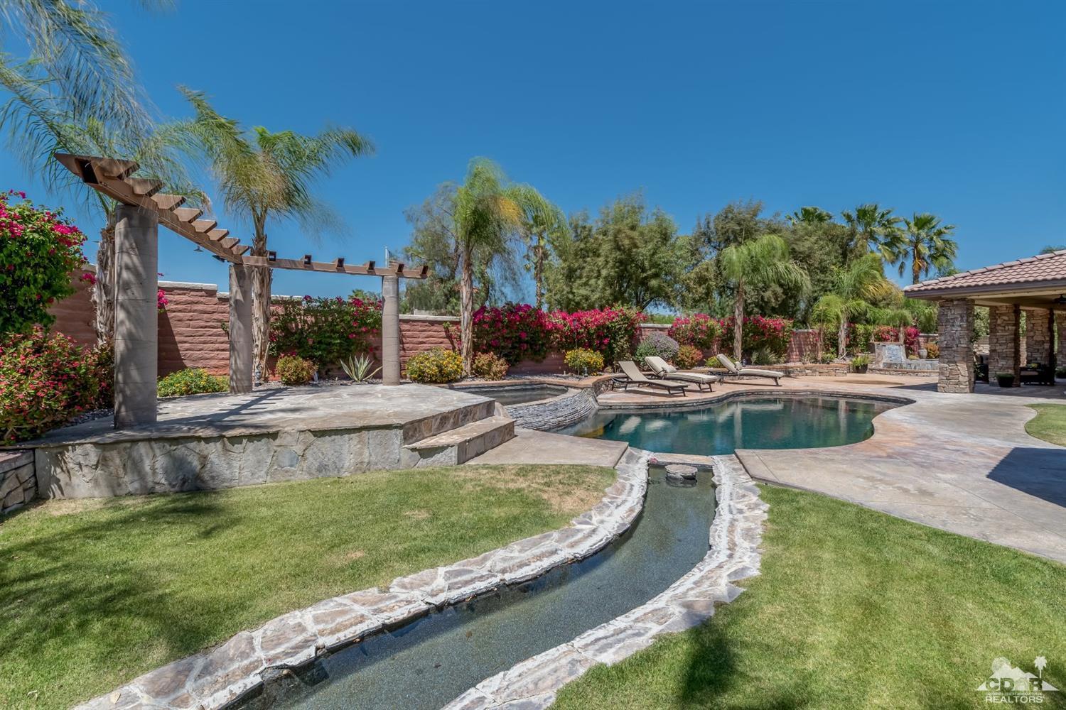 145 Via Solaro Rancho Mirage, CA 92270 - Photo 33 of 40 a view of a swimming pool with a patio