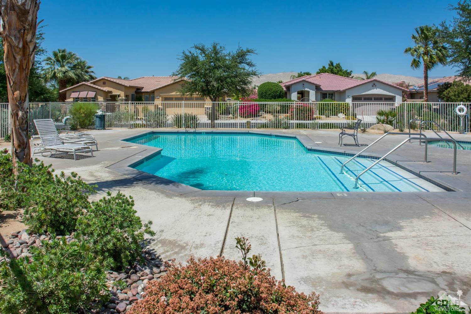 145 Via Solaro Rancho Mirage, CA 92270 - Photo 38 of 40 a view of a house with swimming pool and porch