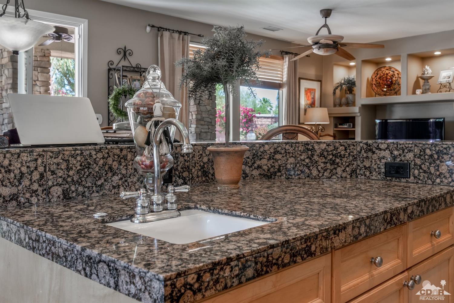 145 Via Solaro Rancho Mirage, CA 92270 - Photo 8 of 40 a kitchen with sink and window