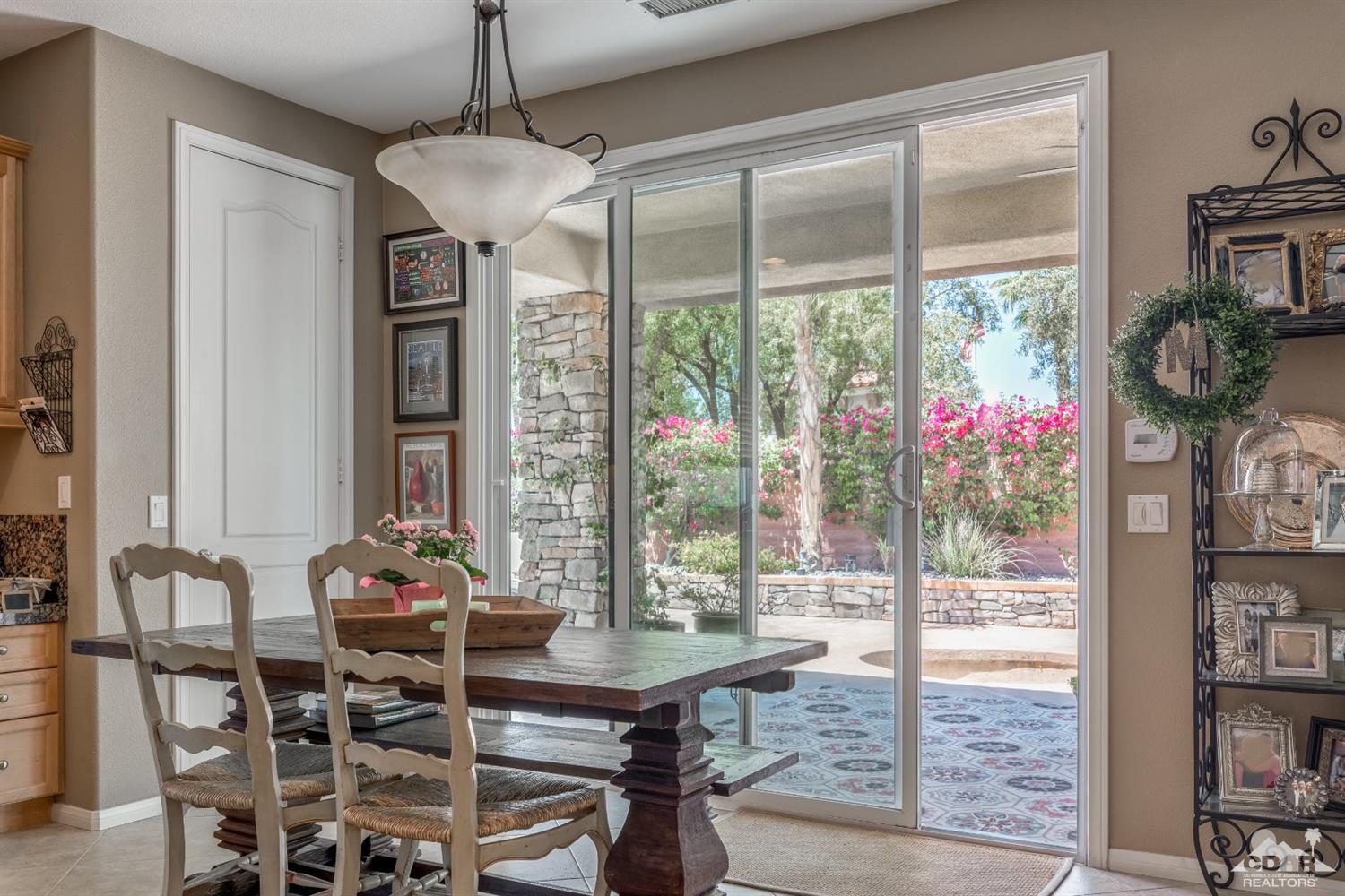 145 Via Solaro Rancho Mirage, CA 92270 - Photo 9 of 40 a view of a dining room with furniture window and outside view
