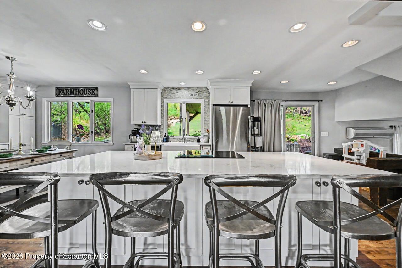 719 Scott Road Clarks Summit, PA 18411 - Photo 8 of 51 a view of a dining room with furniture and a large window