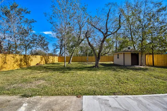 a backyard of a house with lots of green space