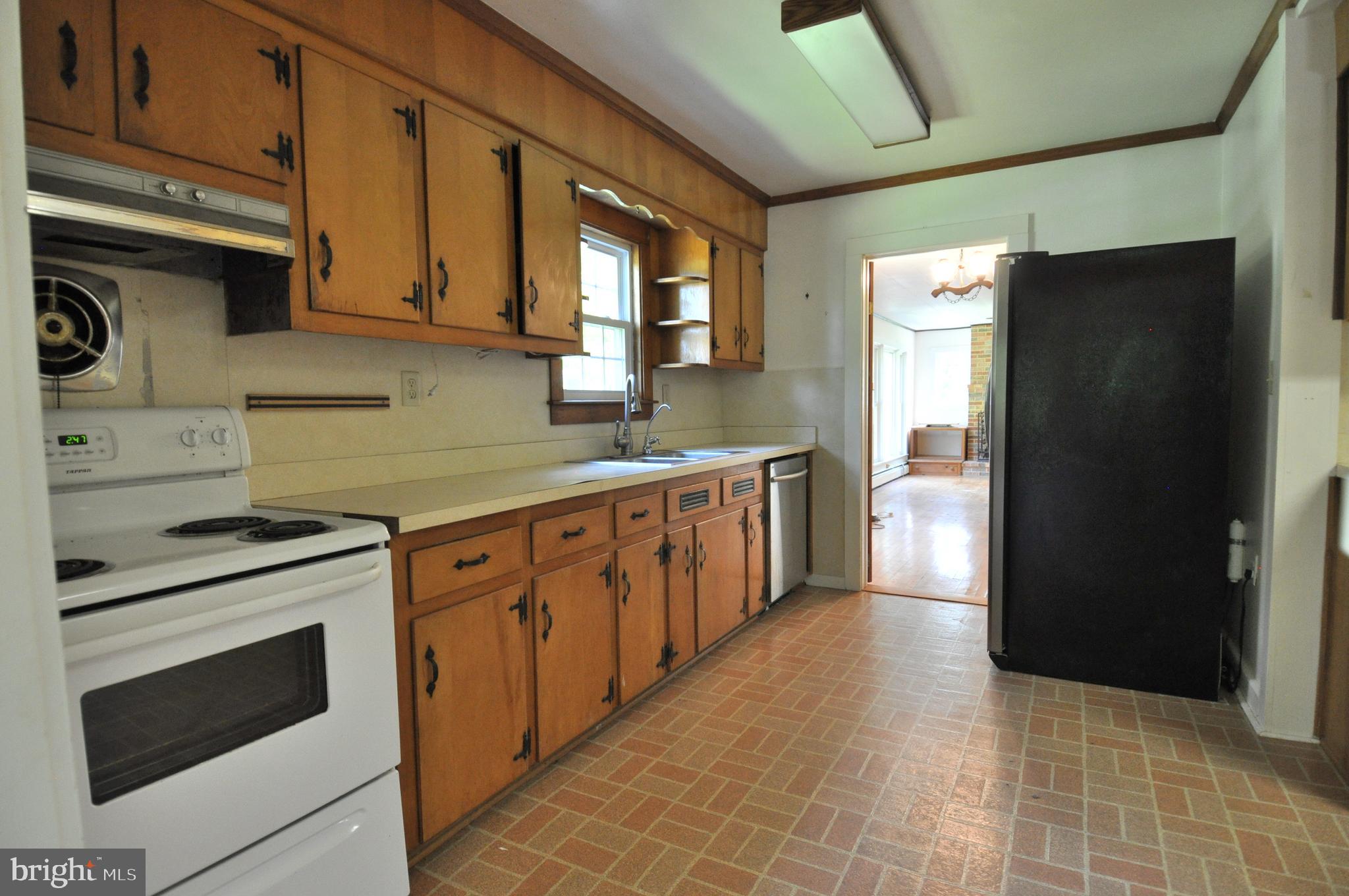 635 Cedar Hall Road Pocomoke City, MD 21851 - Photo 13 of 48 a kitchen with stainless steel appliances granite countertop a stove a refrigerator and a cabinets