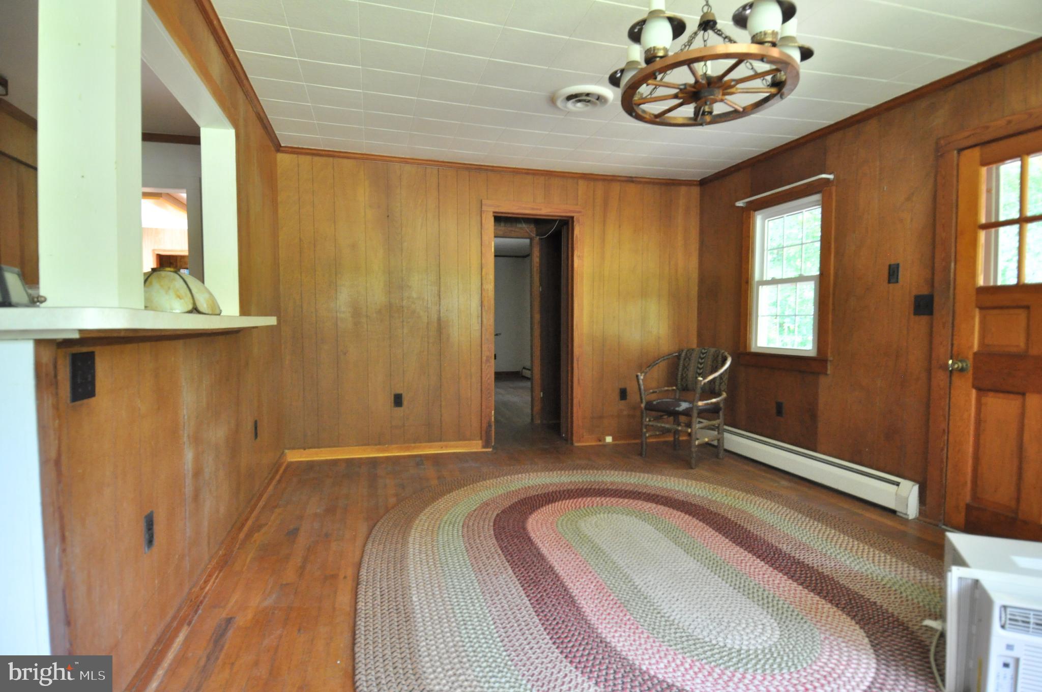 635 Cedar Hall Road Pocomoke City, MD 21851 - Photo 20 of 48 a bedroom with a bed and a table in it