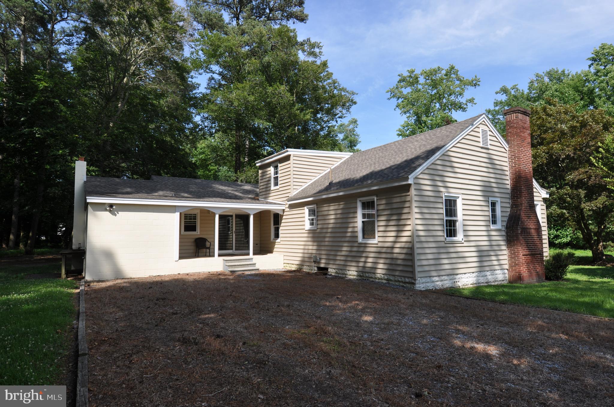 635 Cedar Hall Road Pocomoke City, MD 21851 - Photo 3 of 48 a front view of a house with a yard and garage