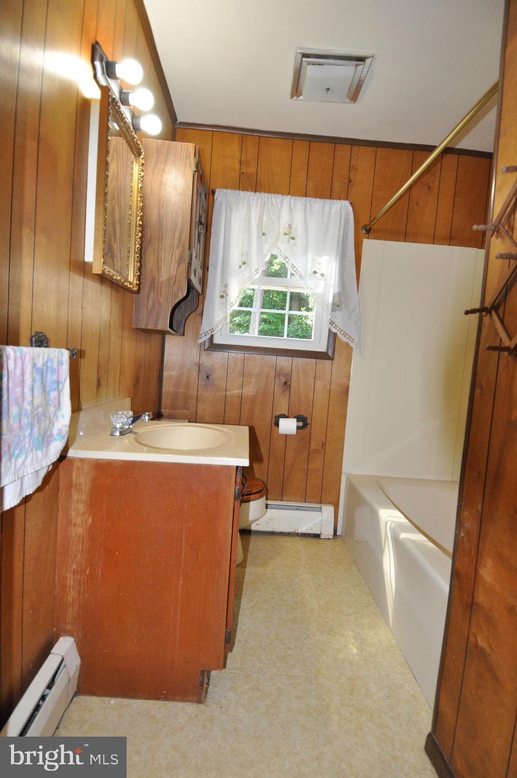 635 Cedar Hall Road Pocomoke City, MD 21851 - Photo 23 of 48 a view of room with window and a couch