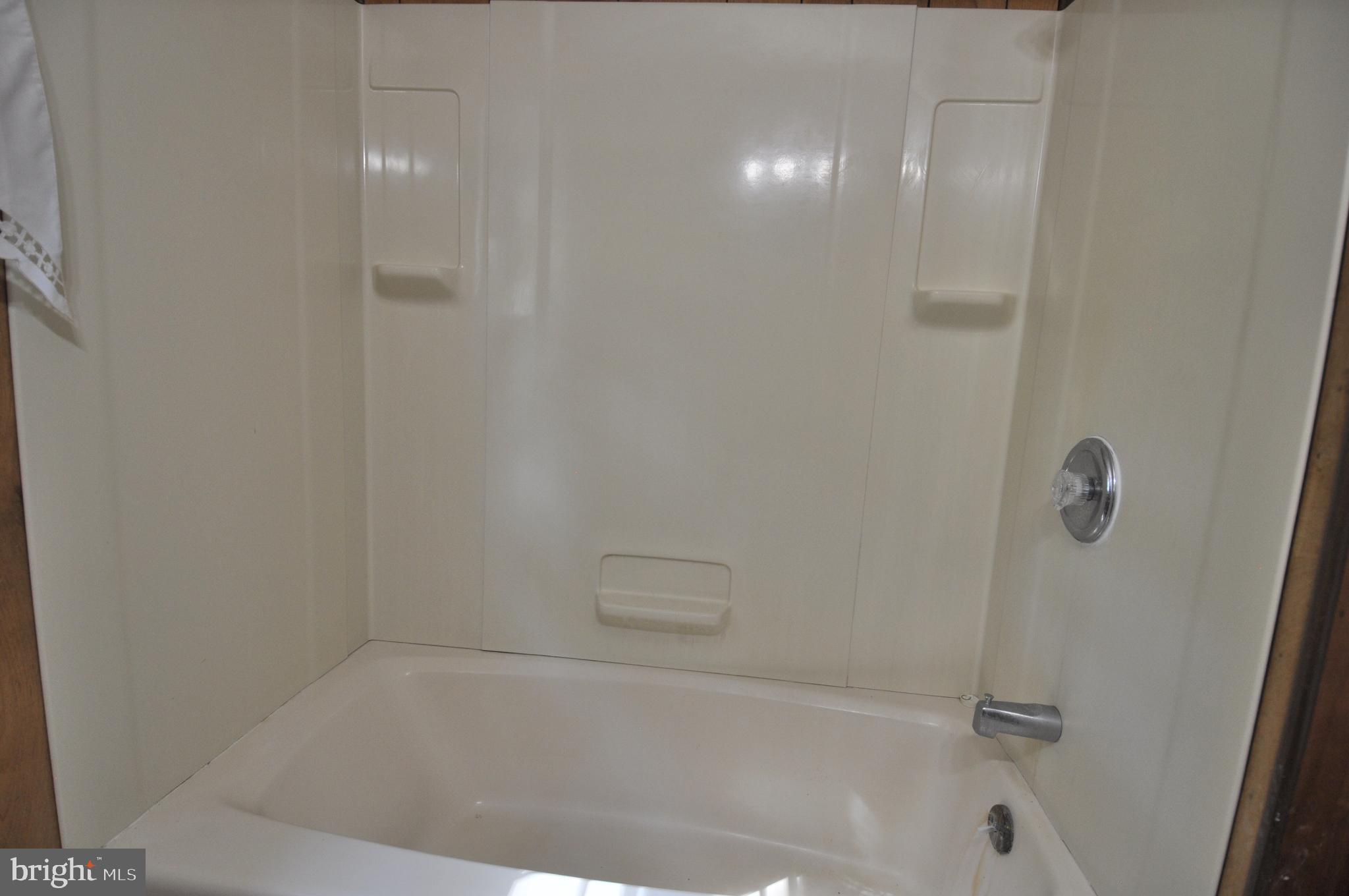 635 Cedar Hall Road Pocomoke City, MD 21851 - Photo 24 of 48 a close up of a bathtub in a bathroom