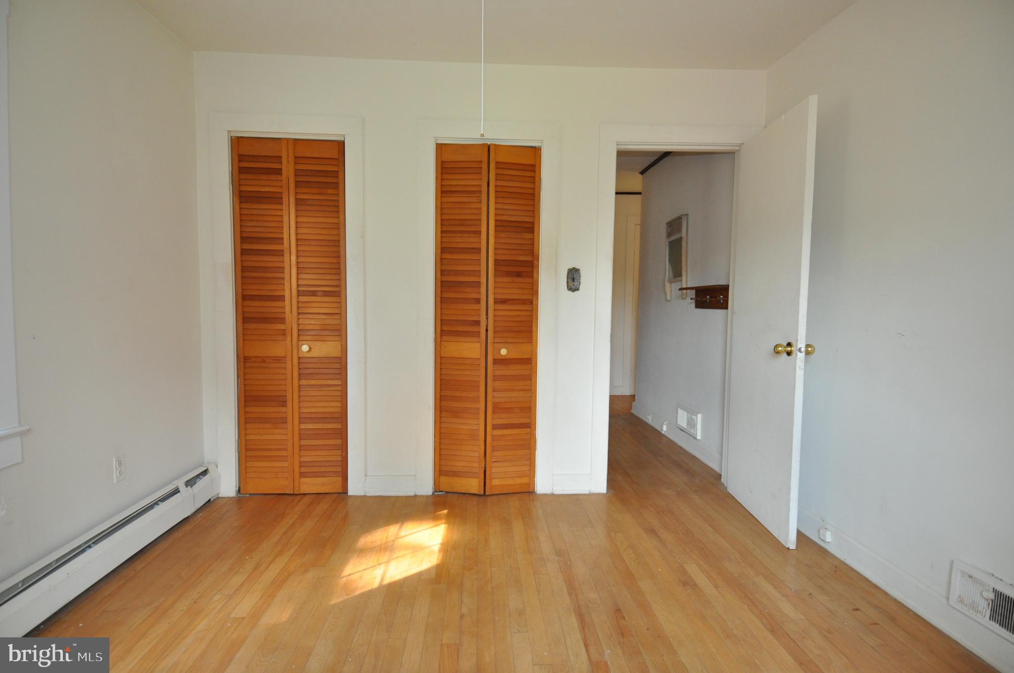 635 Cedar Hall Road Pocomoke City, MD 21851 - Photo 26 of 48 an empty room with wooden floor and windows