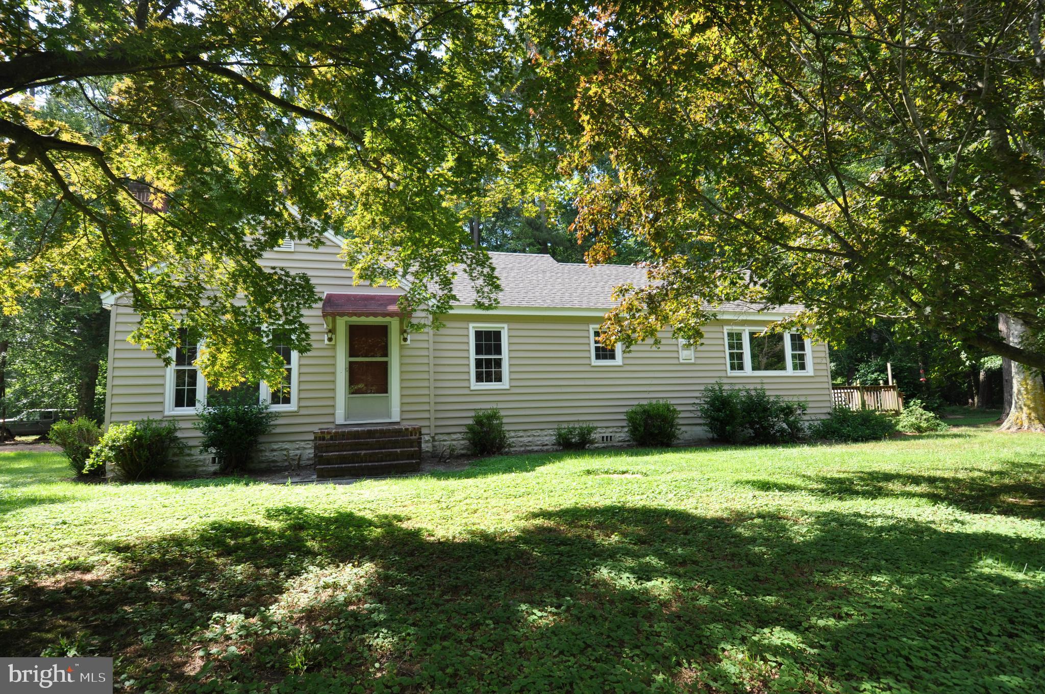 635 Cedar Hall Road Pocomoke City, MD 21851 - Photo 4 of 48 a front view of a house with a yard and garage