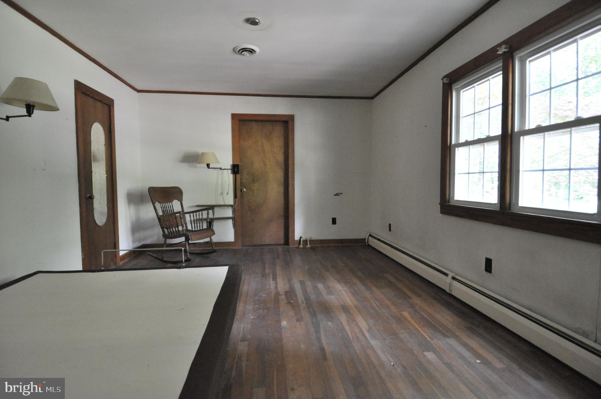 635 Cedar Hall Road Pocomoke City, MD 21851 - Photo 36 of 48 a view of a room with wooden floor and windows