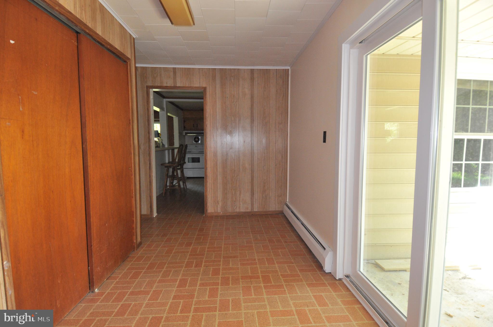 635 Cedar Hall Road Pocomoke City, MD 21851 - Photo 38 of 48 a view of a hallway with wooden shelves