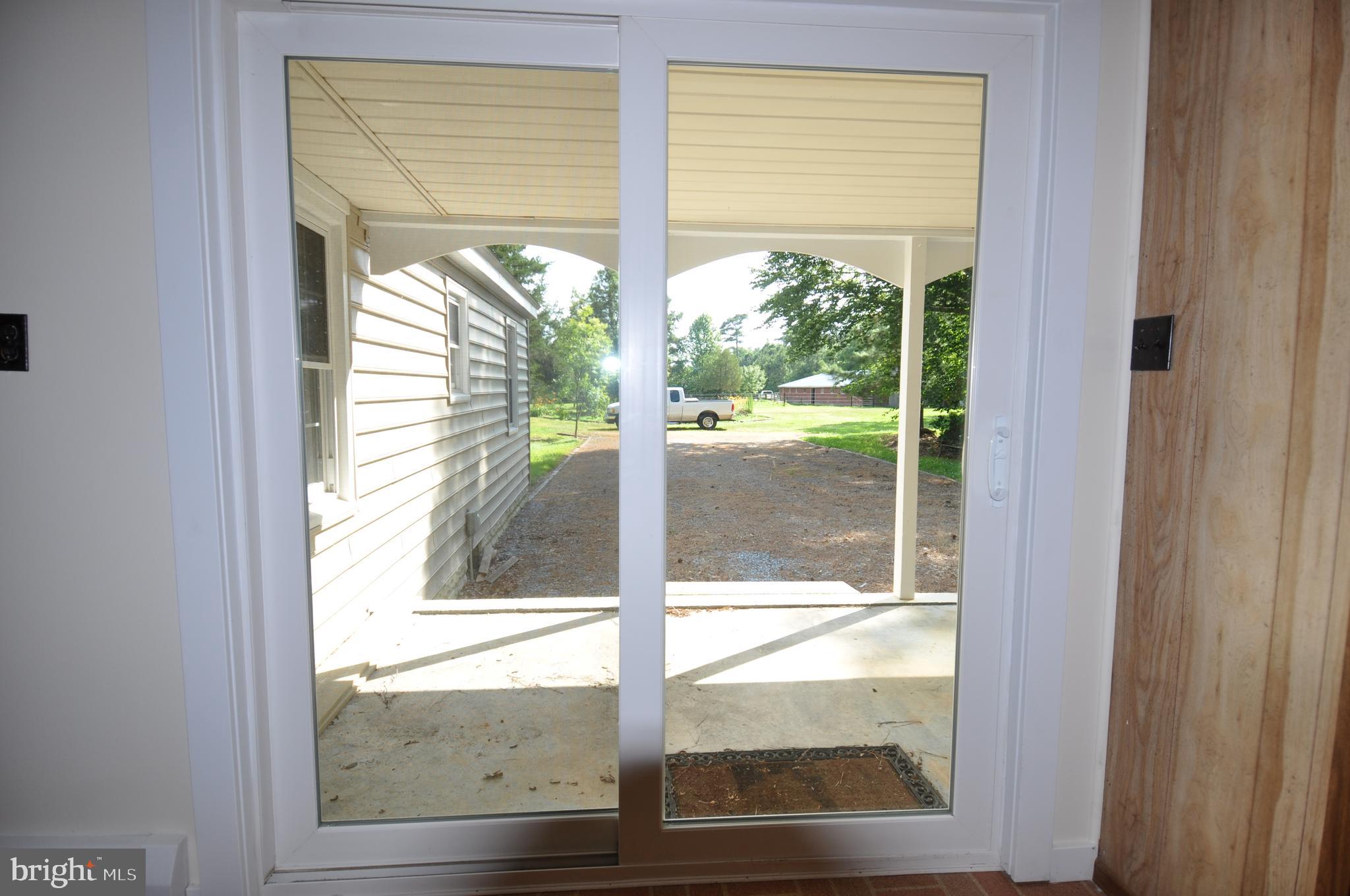 635 Cedar Hall Road Pocomoke City, MD 21851 - Photo 39 of 48 a view of a glass door with a red door and a glass door
