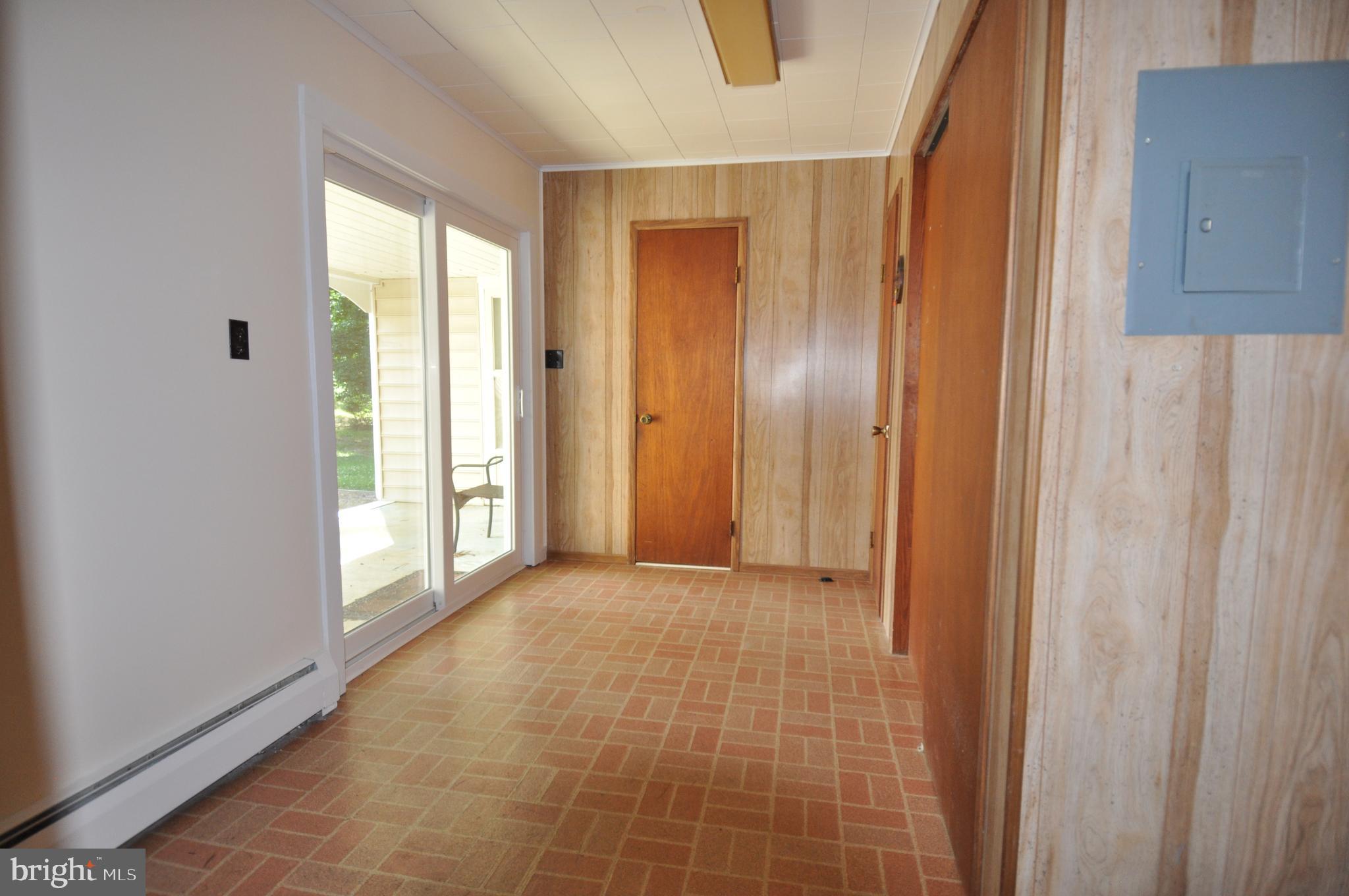 635 Cedar Hall Road Pocomoke City, MD 21851 - Photo 40 of 48 a view of an empty room with wooden floor and a window