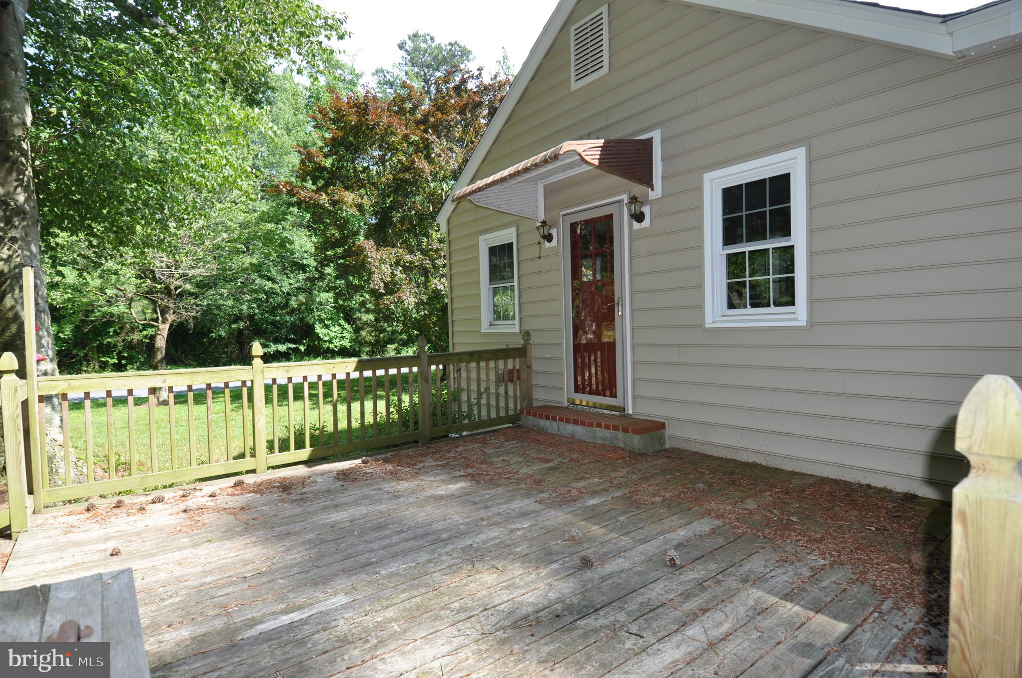 635 Cedar Hall Road Pocomoke City, MD 21851 - Photo 46 of 48 a view of a house with a small yard and wooden fence