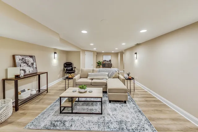 a living room with furniture and a rug