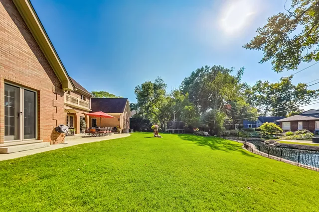 a view of a house with a yard porch and sitting area