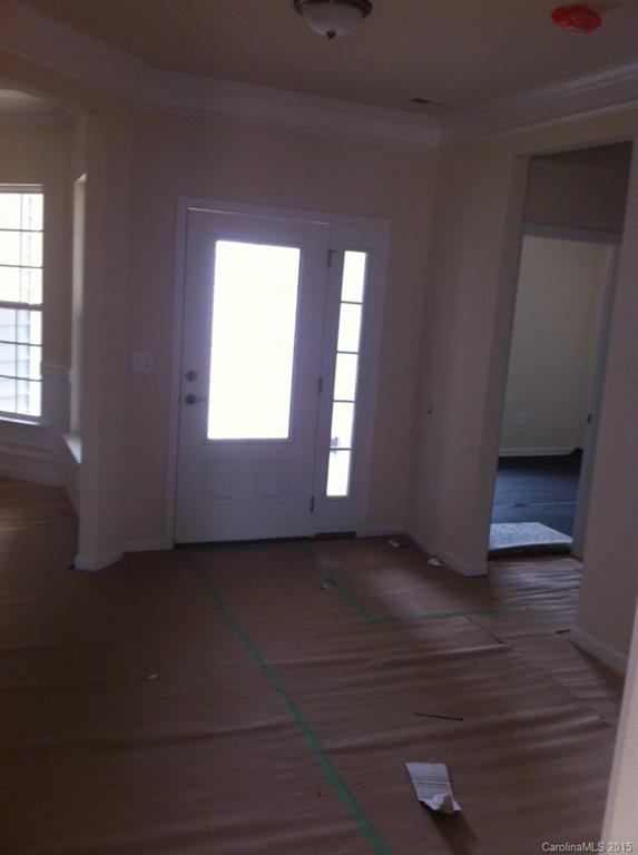 4250 Perth Road, Unit 307 Indian Land, SC 29707 - Photo 10 of 12 a view of an empty room with wooden floor and a window