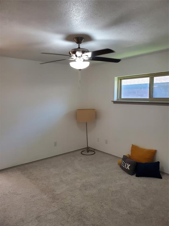 7424 Walling Lane Dallas, TX 75231 - Photo 13 of 19 a view of a room with gym equipment
