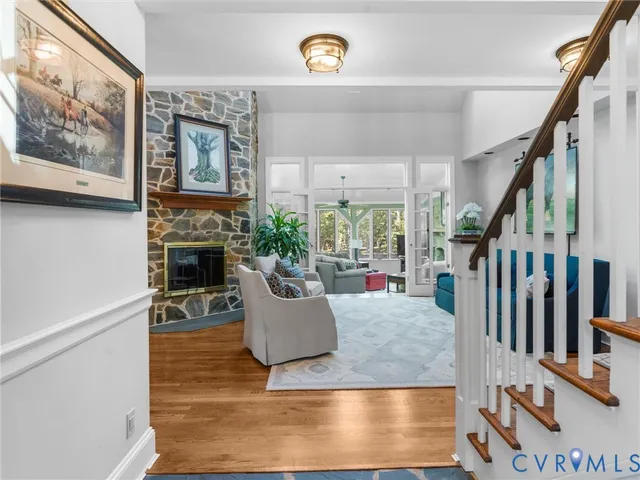 an empty room with a window and a flat screen tv