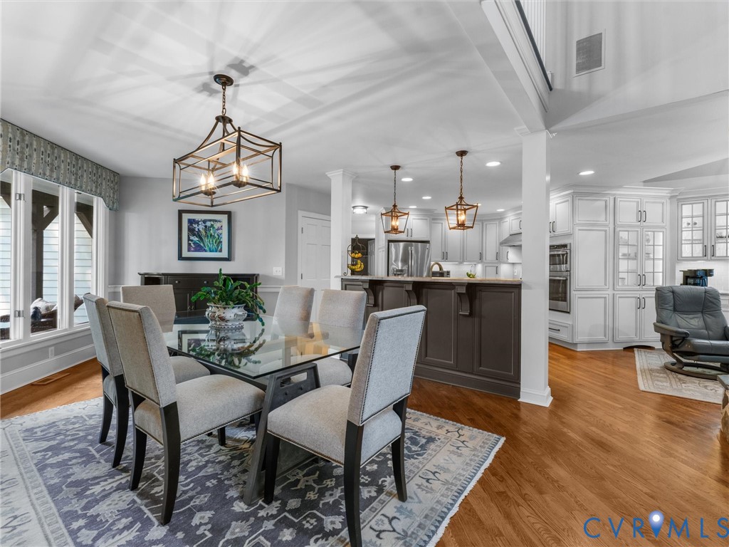 2575 Maidens Road Maidens, VA 23102 - Photo 21 of 50 a dining room with furniture a chandelier and wooden floor
