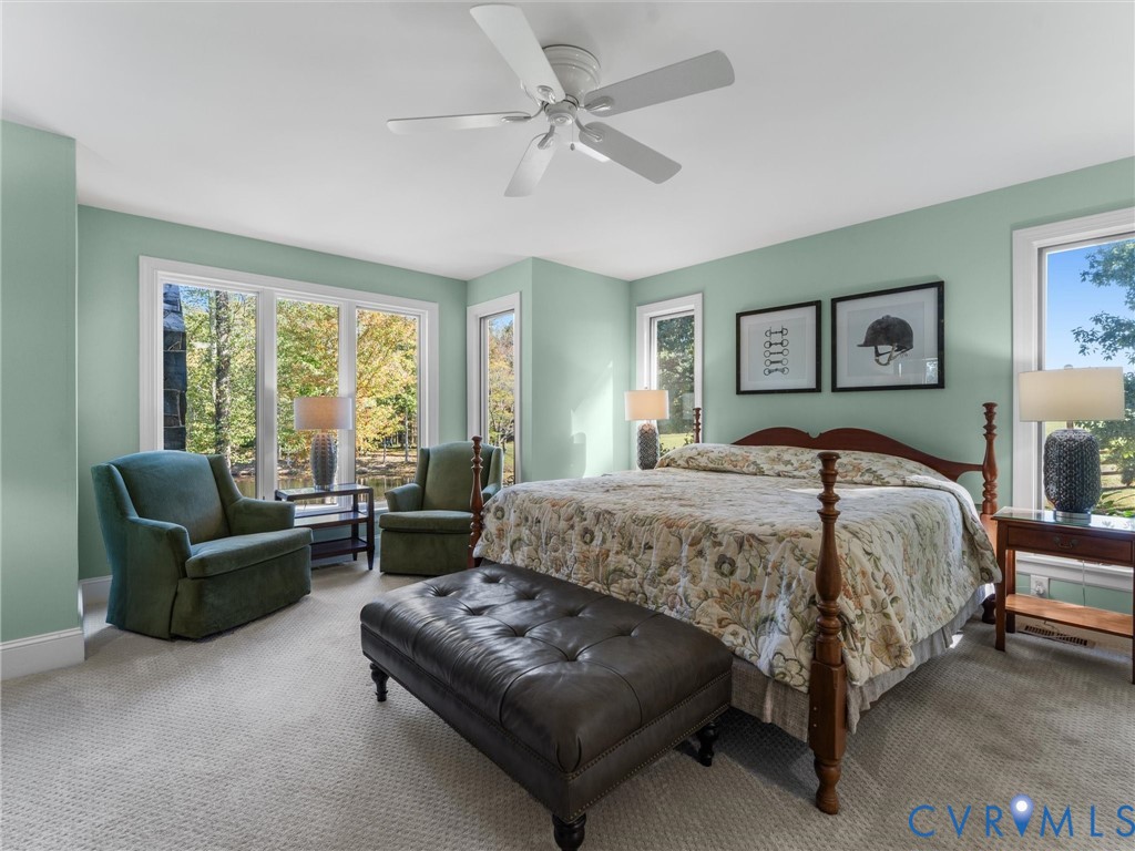 2575 Maidens Road Maidens, VA 23102 - Photo 29 of 50 a spacious bedroom with a bed and a couch