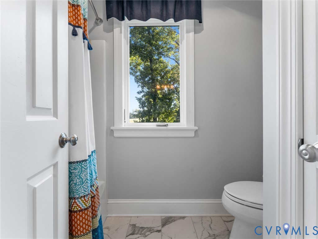 2575 Maidens Road Maidens, VA 23102 - Photo 40 of 50 a bathroom with a toilet and a shower curtain