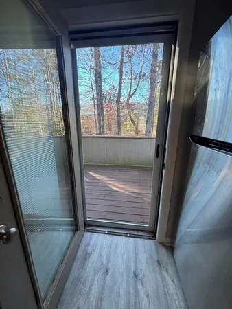 a view of outdoor space with wooden floor and staircase