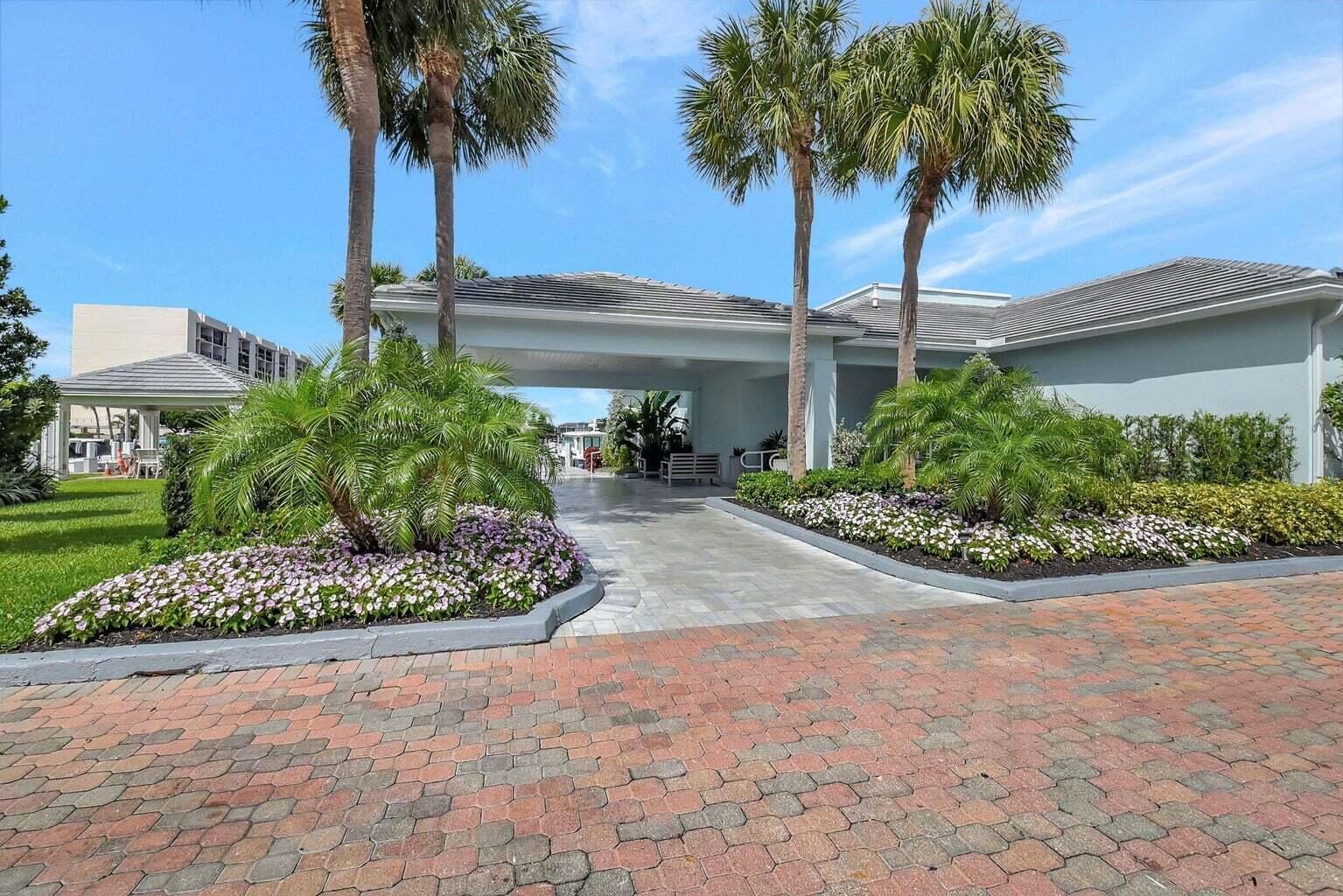 2707 North Ocean Boulevard, Unit D205 Boca Raton, FL 33431 - Photo 31 of 51 a front view of a house with a garden