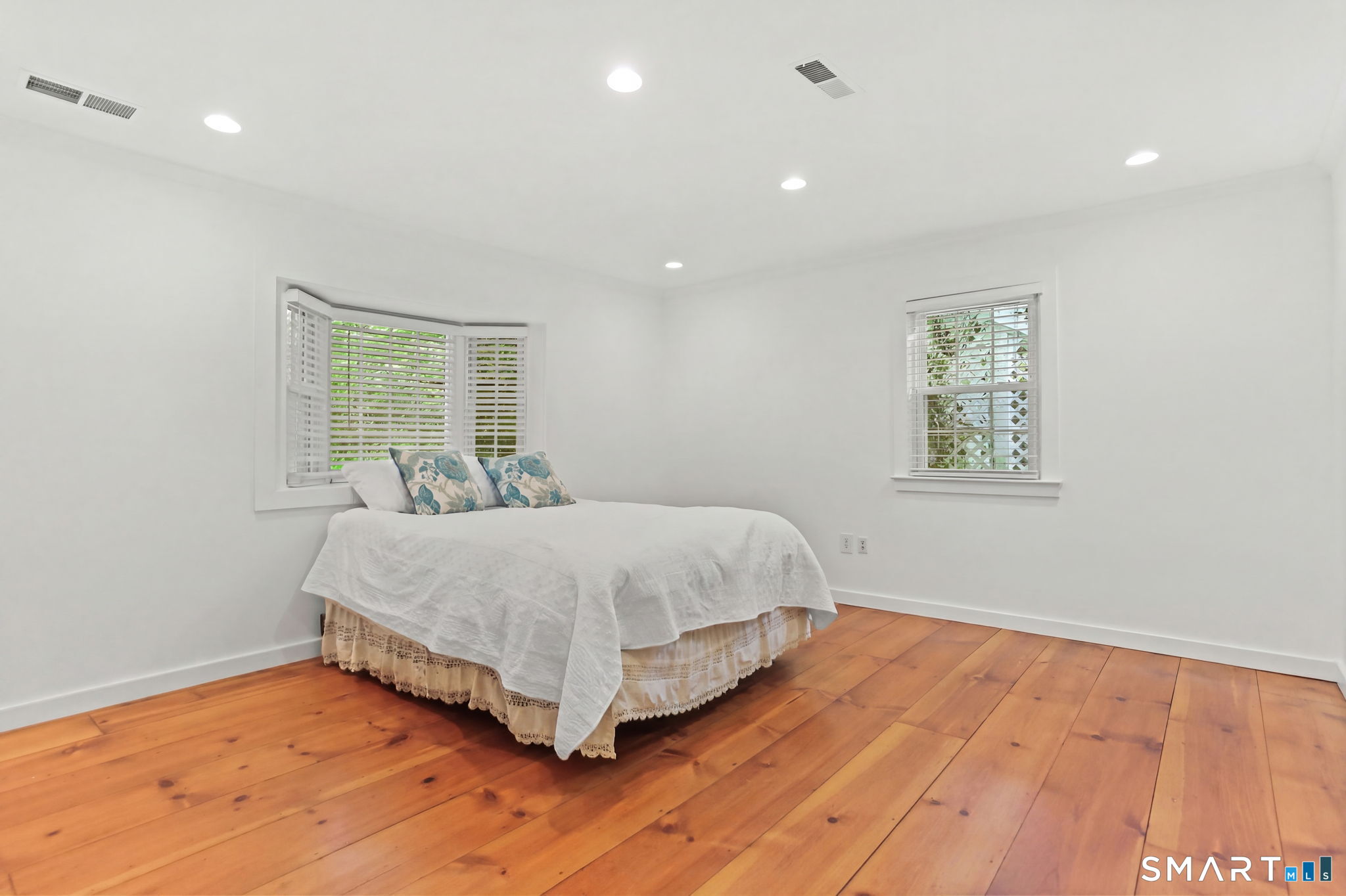 4 Topping Lane Norwalk, CT 06854 - Photo 15 of 30 a bedroom with a bed and a window