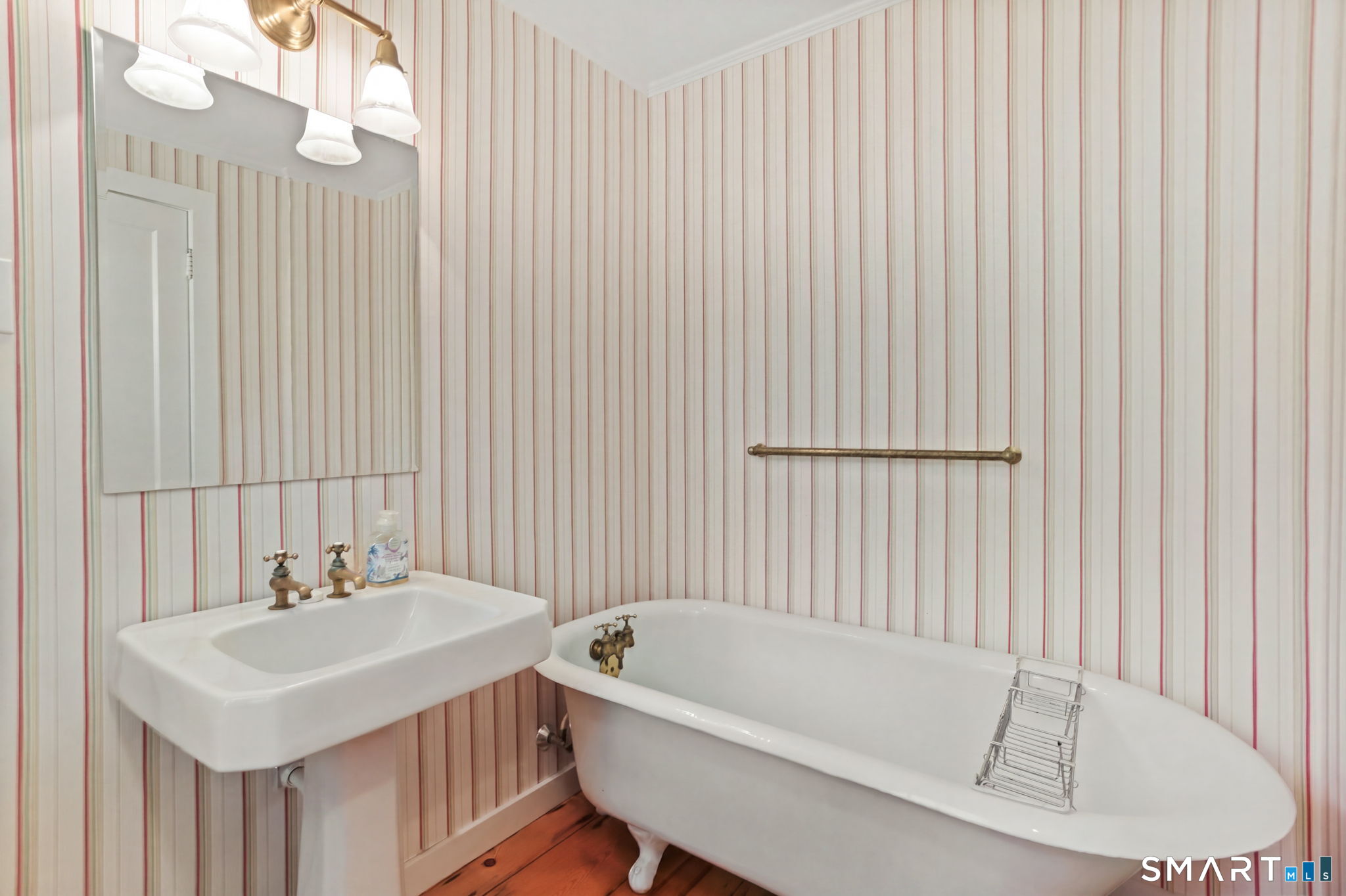 4 Topping Lane Norwalk, CT 06854 - Photo 16 of 30 a bathroom with a sink a bathtub and a shower