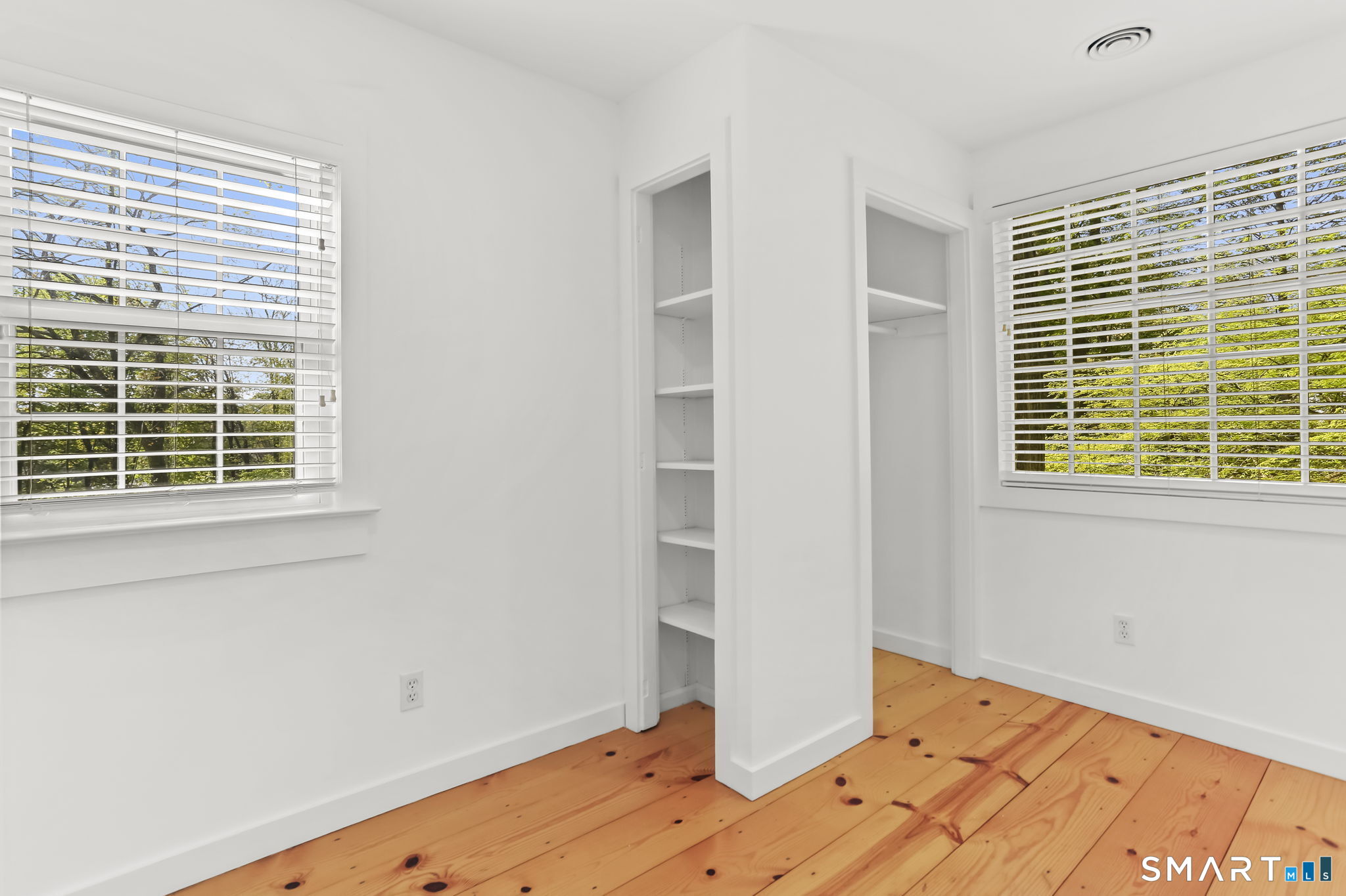 4 Topping Lane Norwalk, CT 06854 - Photo 21 of 30 a view of a room with wooden floor and windows