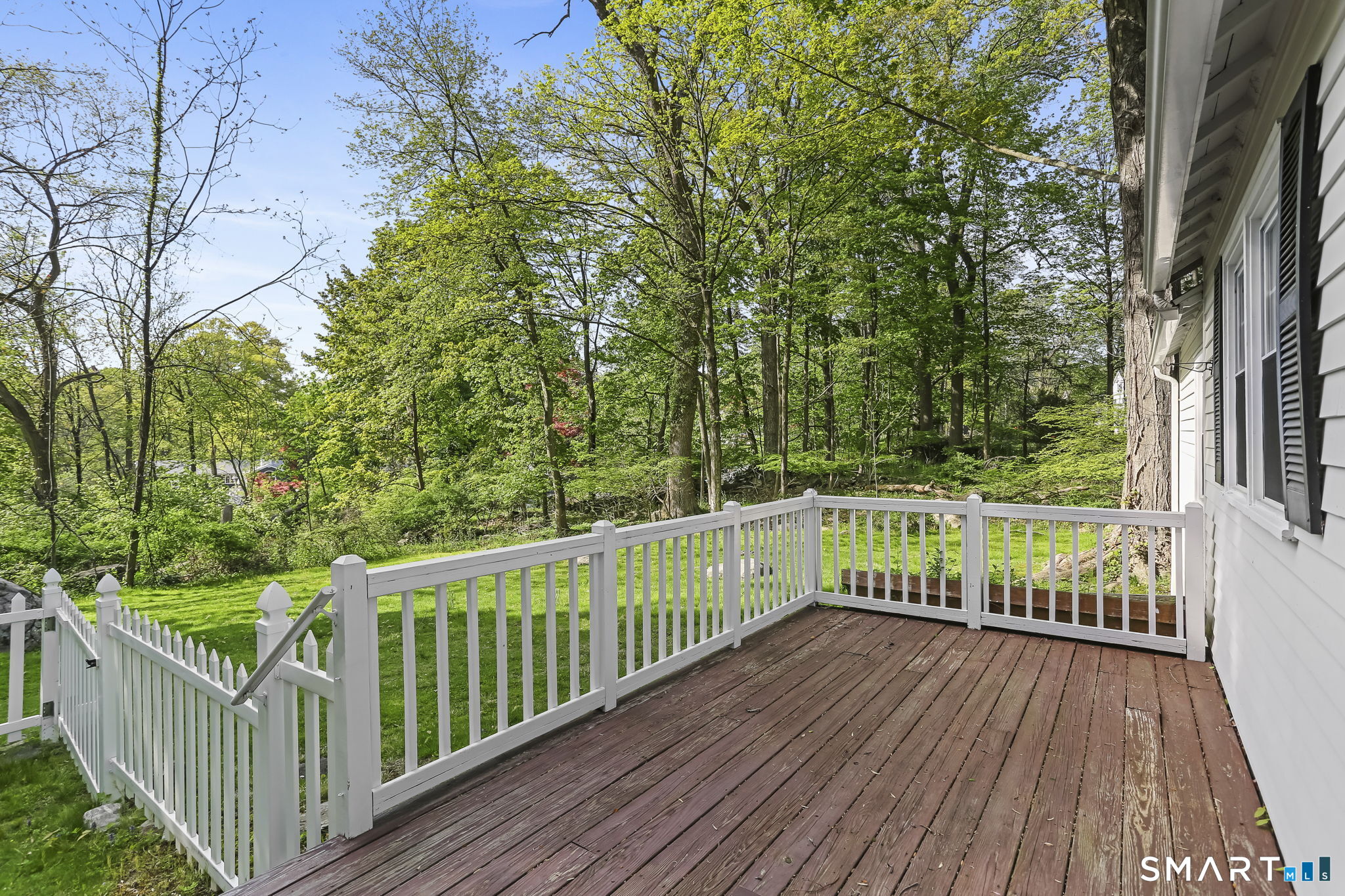 4 Topping Lane Norwalk, CT 06854 - Photo 24 of 30 a view of a balcony with wooden floor and fence