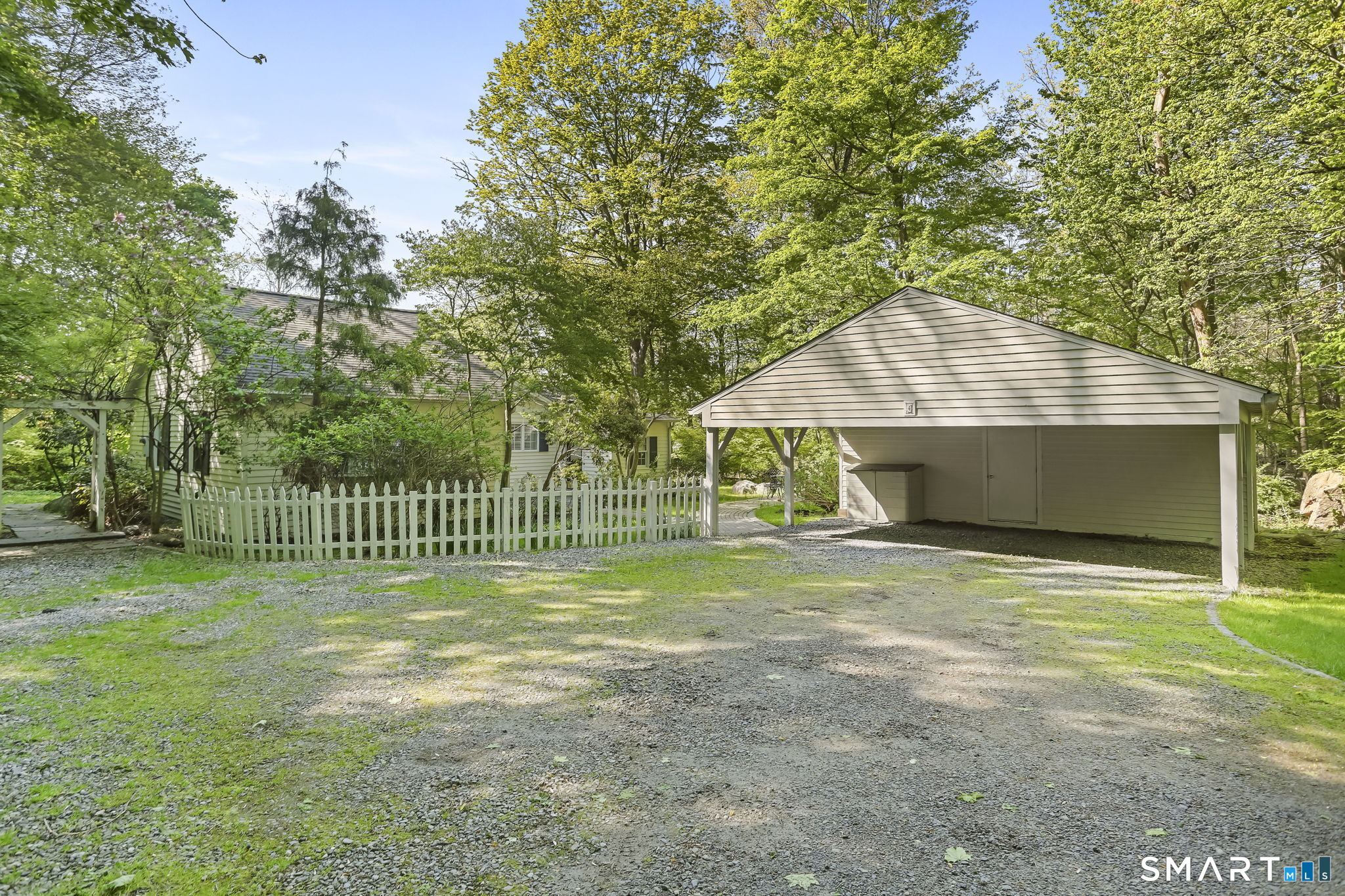 4 Topping Lane Norwalk, CT 06854 - Photo 27 of 30 a front view of a house with a yard and garage
