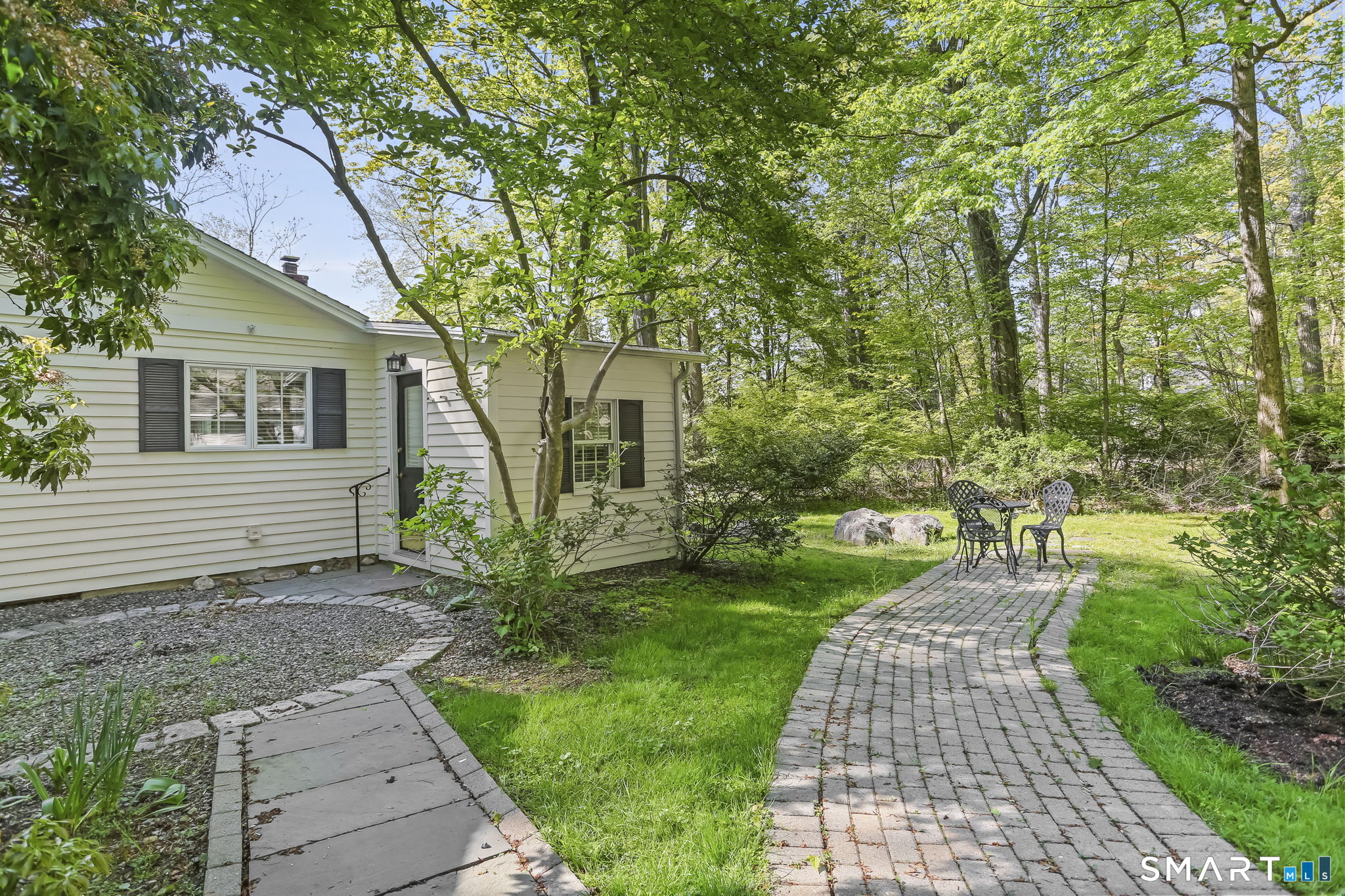 4 Topping Lane Norwalk, CT 06854 - Photo 3 of 30 a front view of a house with garden