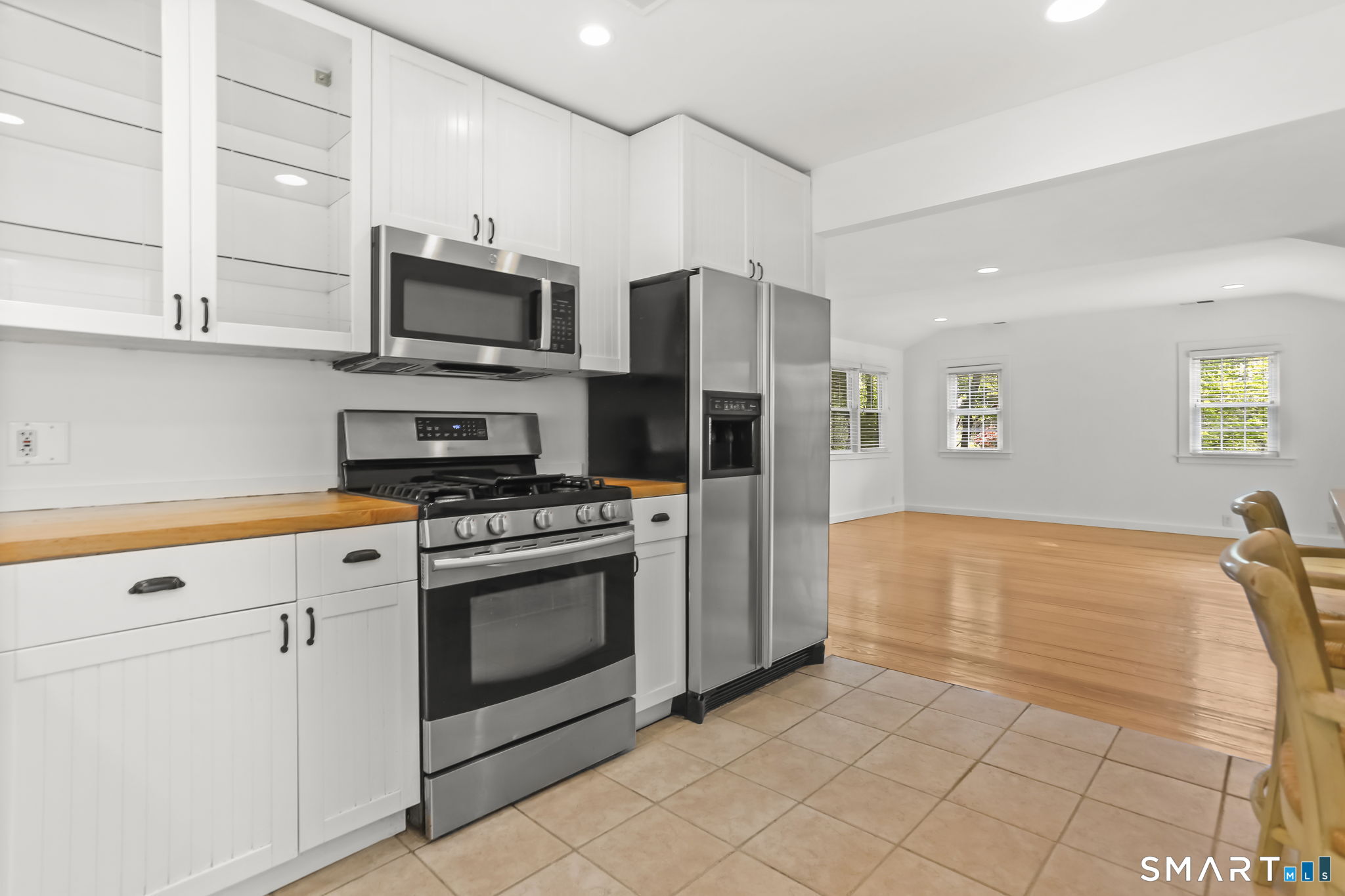 4 Topping Lane Norwalk, CT 06854 - Photo 9 of 30 a kitchen with stainless steel appliances granite countertop a stove a sink and a refrigerator