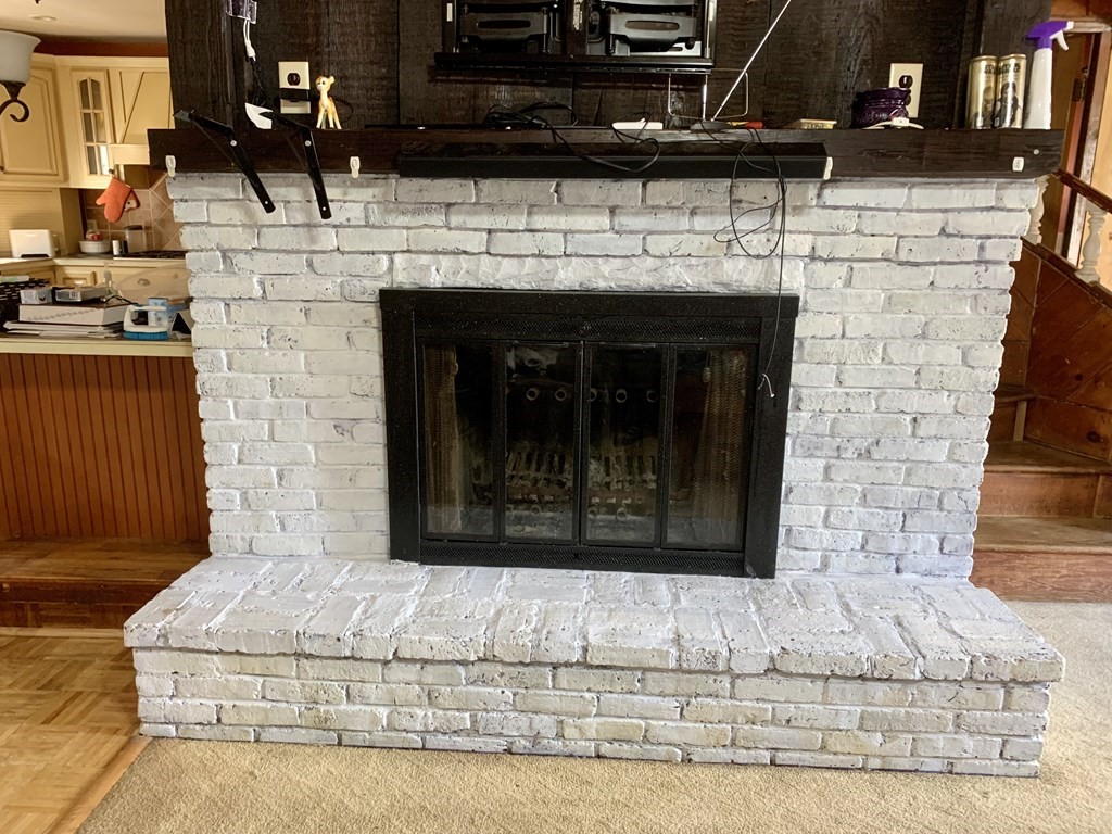 19 Beacon Street Fall River, MA 02721 - Photo 17 of 33 a living room with a fireplace